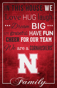 Nebraska Cornhuskers In This House Wood Sign - 17"x26"